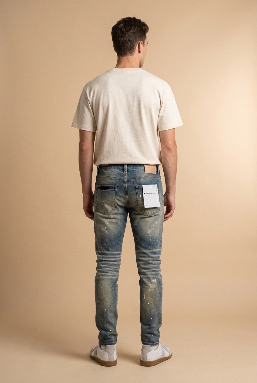 Purple Brand Distressed and Faded Blue Jeans with Paint Splatters